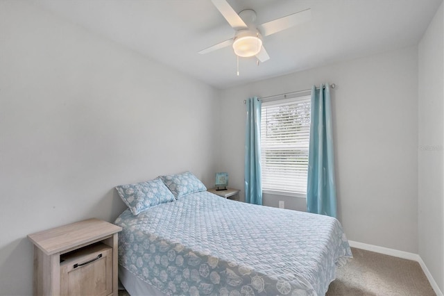 bedroom featuring ceiling fan, baseboards, and light colored carpet