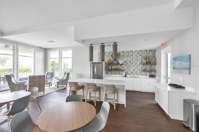 dining space featuring recessed lighting and dark wood-style flooring