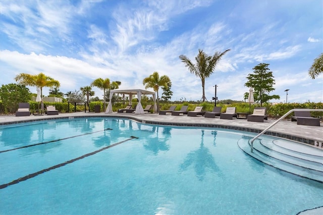 community pool featuring a gazebo and a patio area