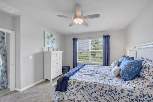 bedroom with baseboards, ceiling fan, and light colored carpet