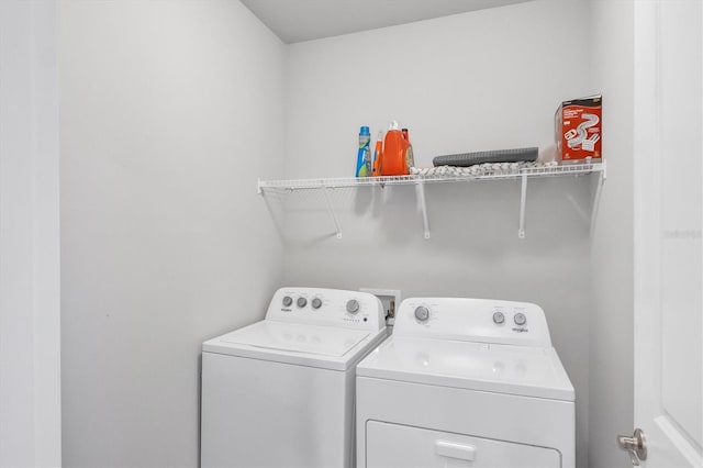 laundry area featuring laundry area and washing machine and clothes dryer