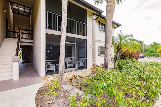 doorway to property with a patio area