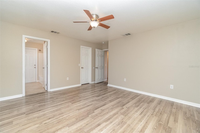 unfurnished bedroom featuring ceiling fan, connected bathroom, and light hardwood / wood-style flooring