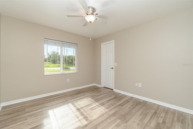 spare room with ceiling fan and light hardwood / wood-style floors