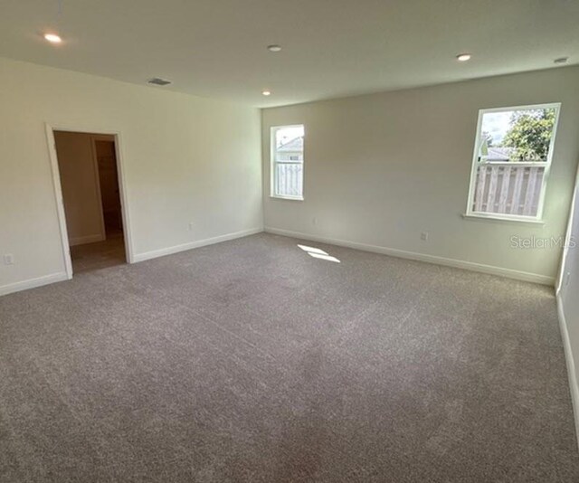 unfurnished room featuring carpet floors