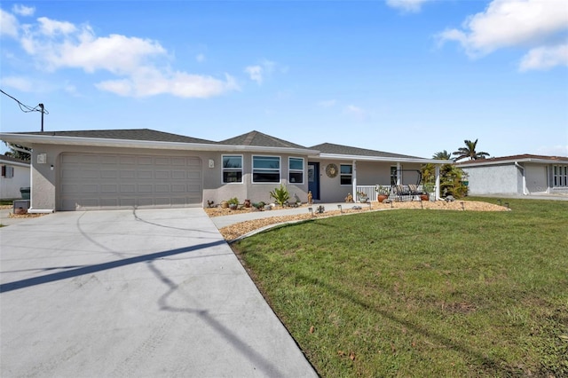 single story home with covered porch, a garage, and a front lawn