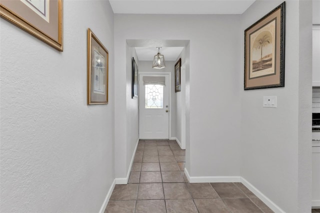 hall featuring tile patterned flooring