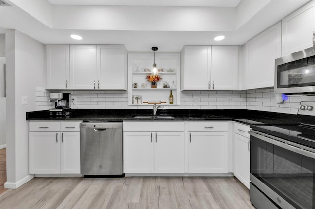 kitchen featuring sink, white cabinets, and stainless steel appliances