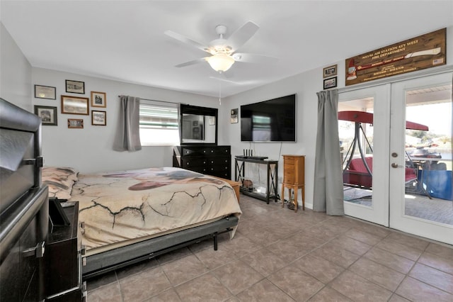 tiled bedroom featuring french doors, ceiling fan, multiple windows, and access to exterior