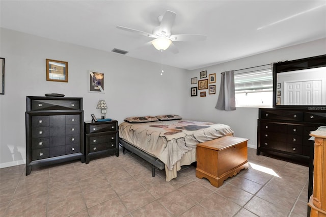 bedroom with light tile patterned flooring and ceiling fan