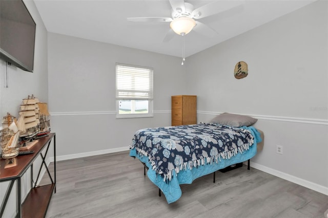 bedroom featuring ceiling fan and hardwood / wood-style floors