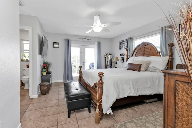 tiled bedroom with ensuite bath and ceiling fan