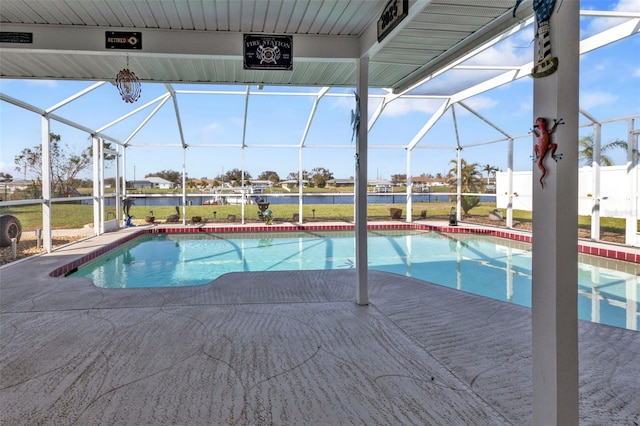 view of swimming pool featuring a patio area and glass enclosure