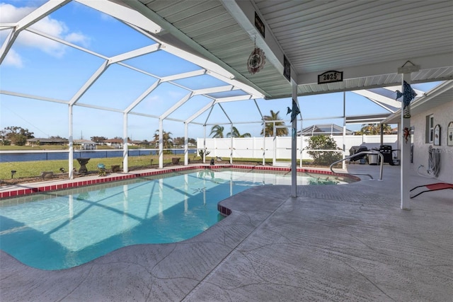 view of pool with a patio area and a lanai