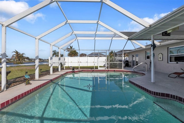 view of pool with a patio and a lanai