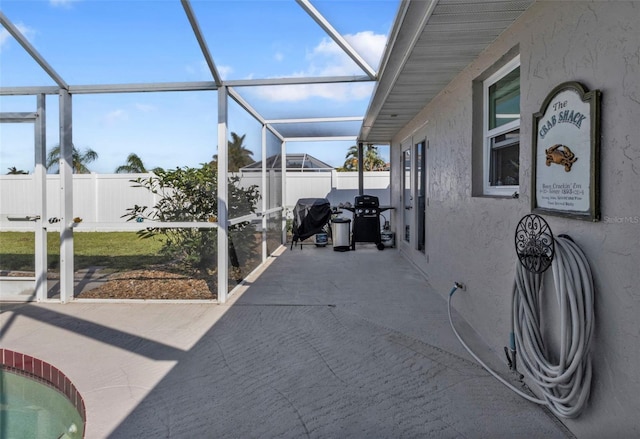 view of patio / terrace featuring a lanai and a grill