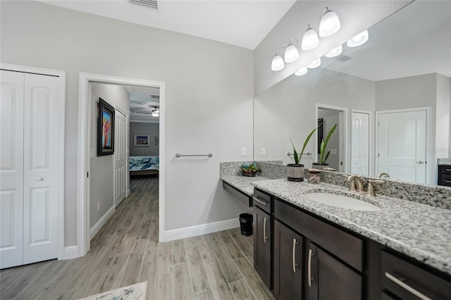 bathroom featuring vanity and ceiling fan