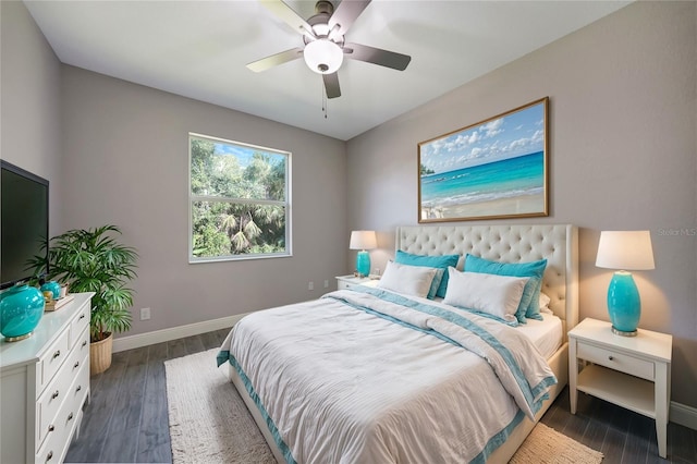 bedroom with dark hardwood / wood-style flooring and ceiling fan