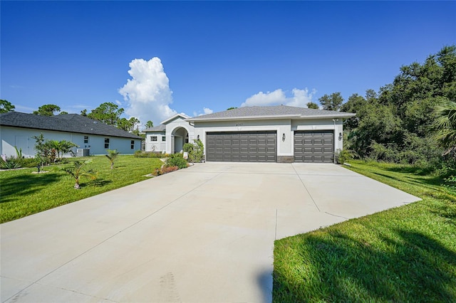 ranch-style house with a front yard and a garage