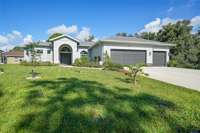 ranch-style home with a front yard and a garage