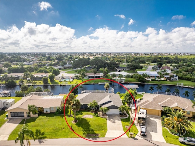 birds eye view of property with a water view