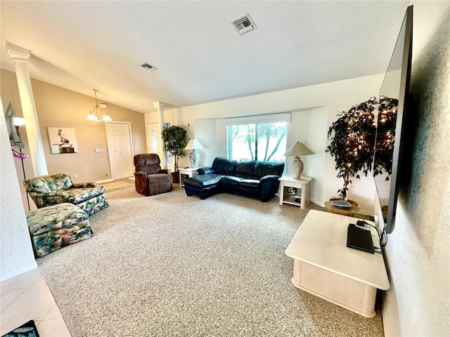 living room with decorative columns, a chandelier, a textured ceiling, vaulted ceiling, and light tile patterned flooring