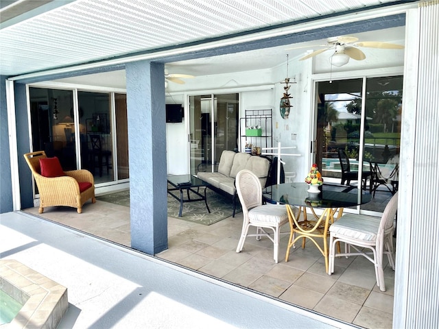 view of patio / terrace featuring ceiling fan