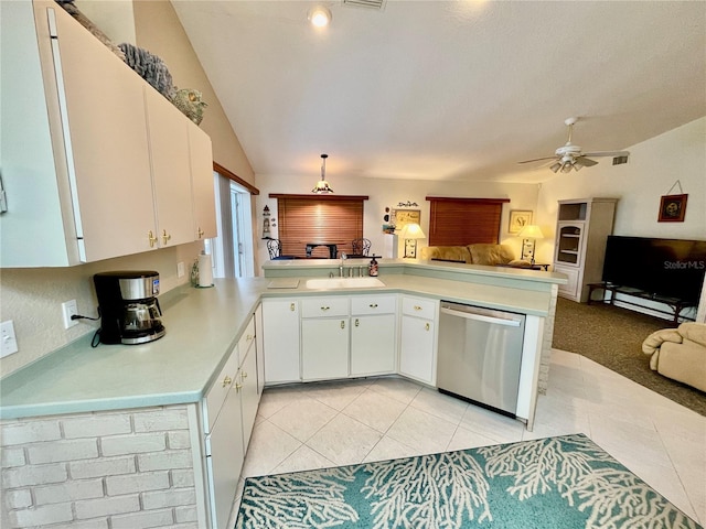 kitchen featuring white cabinetry, sink, stainless steel dishwasher, kitchen peninsula, and light tile patterned floors