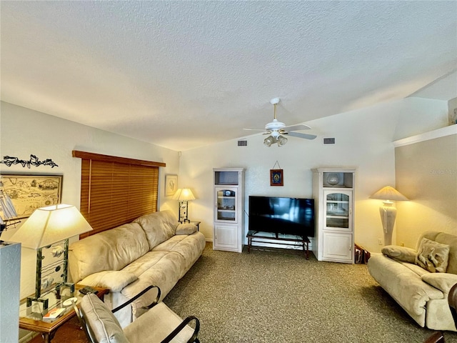 living room with carpet, a textured ceiling, ceiling fan, and lofted ceiling