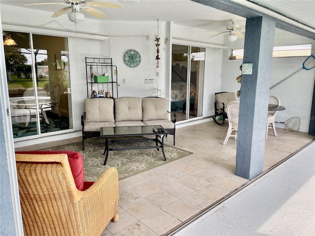 view of patio featuring ceiling fan