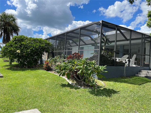 view of yard with glass enclosure