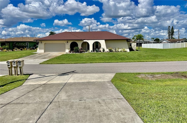 view of front of house with a garage and a front yard