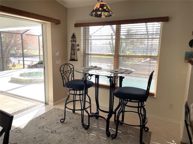 dining space with light tile patterned floors