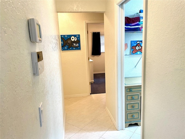 hallway with light tile patterned floors