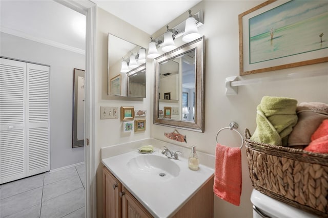 bathroom featuring crown molding, tile patterned flooring, vanity, and toilet