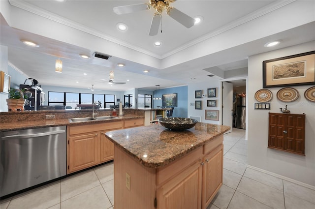 kitchen with stainless steel dishwasher, ornamental molding, a center island, and sink