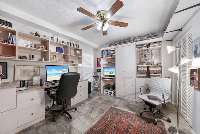 office space with ceiling fan and a textured ceiling