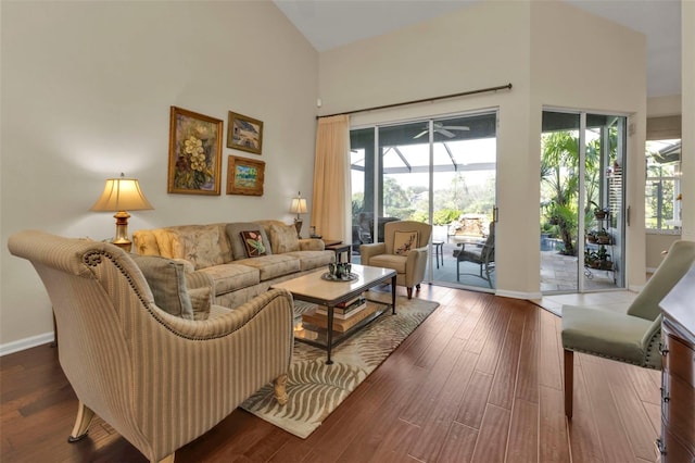 living room featuring hardwood / wood-style floors and high vaulted ceiling