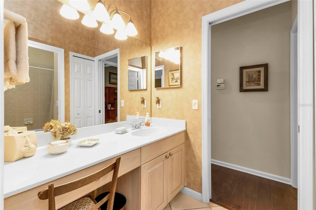 bathroom featuring vanity and hardwood / wood-style flooring