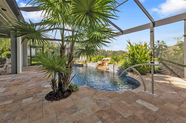 view of pool with a patio area and pool water feature