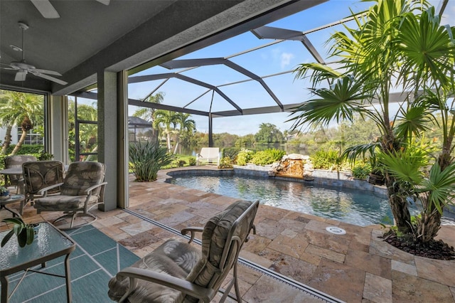 view of patio / terrace featuring glass enclosure and ceiling fan