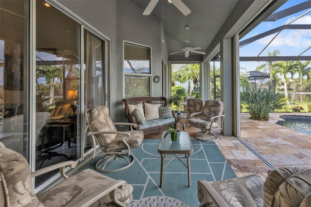 sunroom featuring vaulted ceiling and ceiling fan