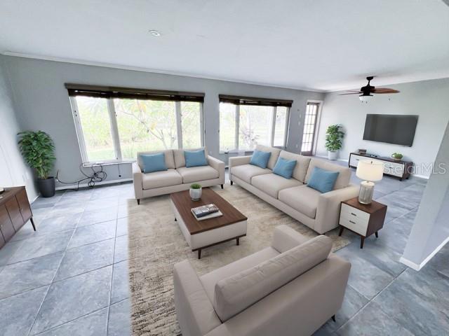 living room with tile patterned floors and ceiling fan