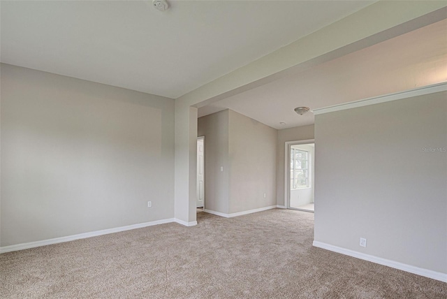 unfurnished room with light carpet