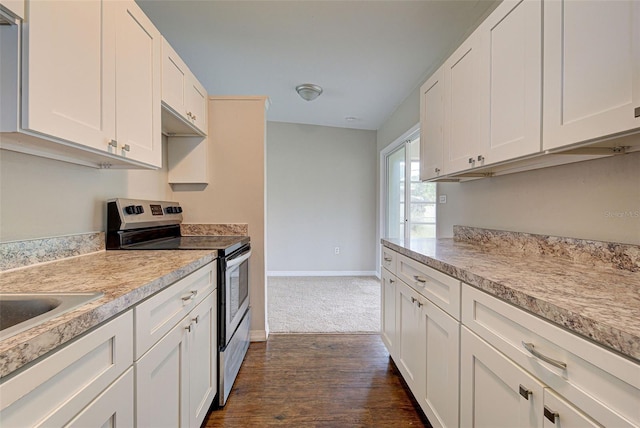 kitchen with stainless steel range with electric stovetop, dark hardwood / wood-style flooring, and white cabinets