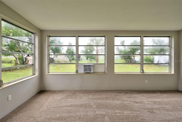 empty room with carpet floors and cooling unit