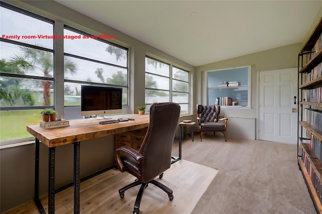 office area featuring light hardwood / wood-style floors, plenty of natural light, and vaulted ceiling