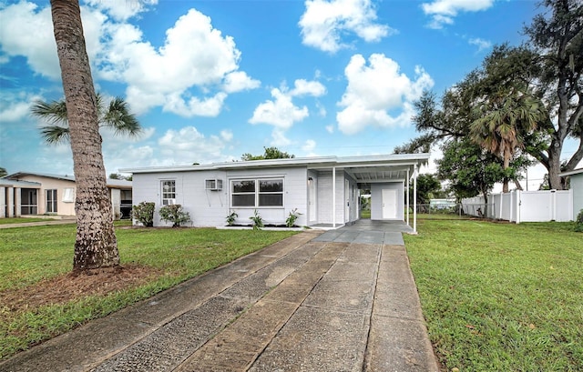 view of front facade featuring a front lawn and a carport