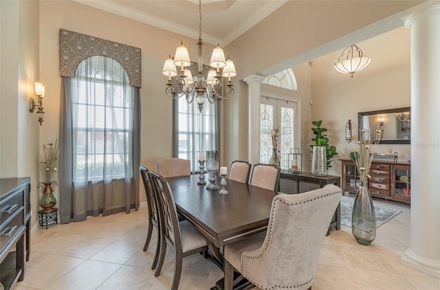 tiled dining space featuring french doors, a healthy amount of sunlight, and ornate columns