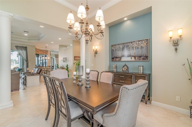 tiled dining area featuring ornamental molding, decorative columns, and a notable chandelier